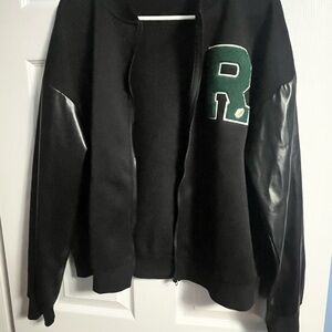 Black Jacket with Green 'R' Letter Patch